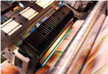 Bottom-Line Building For Newspaper Printers